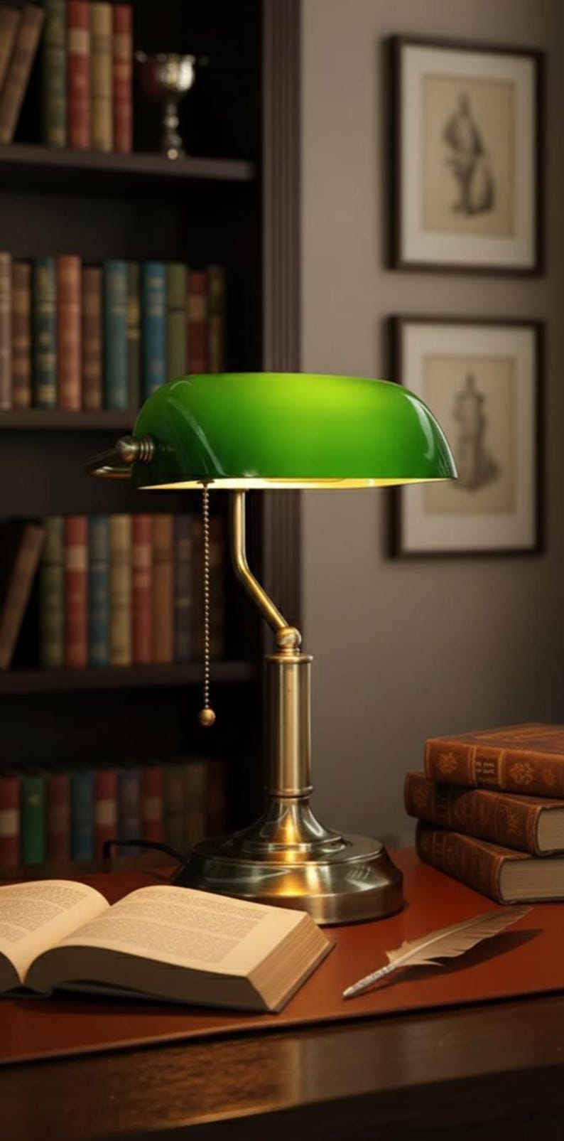 May include: A green-shaded banker's lamp with a brass base sits on a desk with an open book and a quill. A stack of books and a bookshelf filled with books are in the background. The scene evokes a classic library setting.