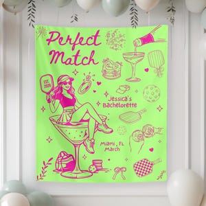 May include: A neon green banner with the words "Perfect Match" and "Jessica's Bachelorette" in pink. The banner features illustrations of a woman in a martini glass, a ring, and other party-themed graphics. The banner is decorated with balloons.