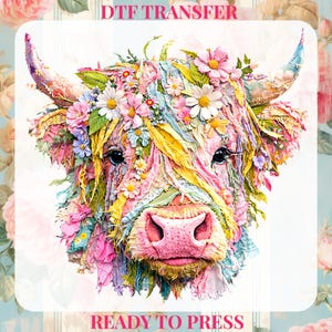 May include: A vibrant DTF transfer design of a Highland cow decorated with flowers. The cow's face is a mix of pink, yellow, and blue, with the text "DTF TRANSFER" and "READY TO PRESS" in red.