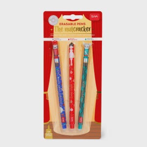 May include: A pack of three erasable pens themed around The Nutcracker. The pens are blue, red, and green, each with a unique design and the text "Nuts About Christmas", "Jingle Dance", and "Merry Squeakmas". The packaging is red and features a stage curtain design.