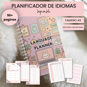 May include: A pink spiral-bound language planner with a bunny illustration and the words "Language Planner." The planner includes note pages and templates. The cover also has the text "90+ pages" and "Tamaño A5".