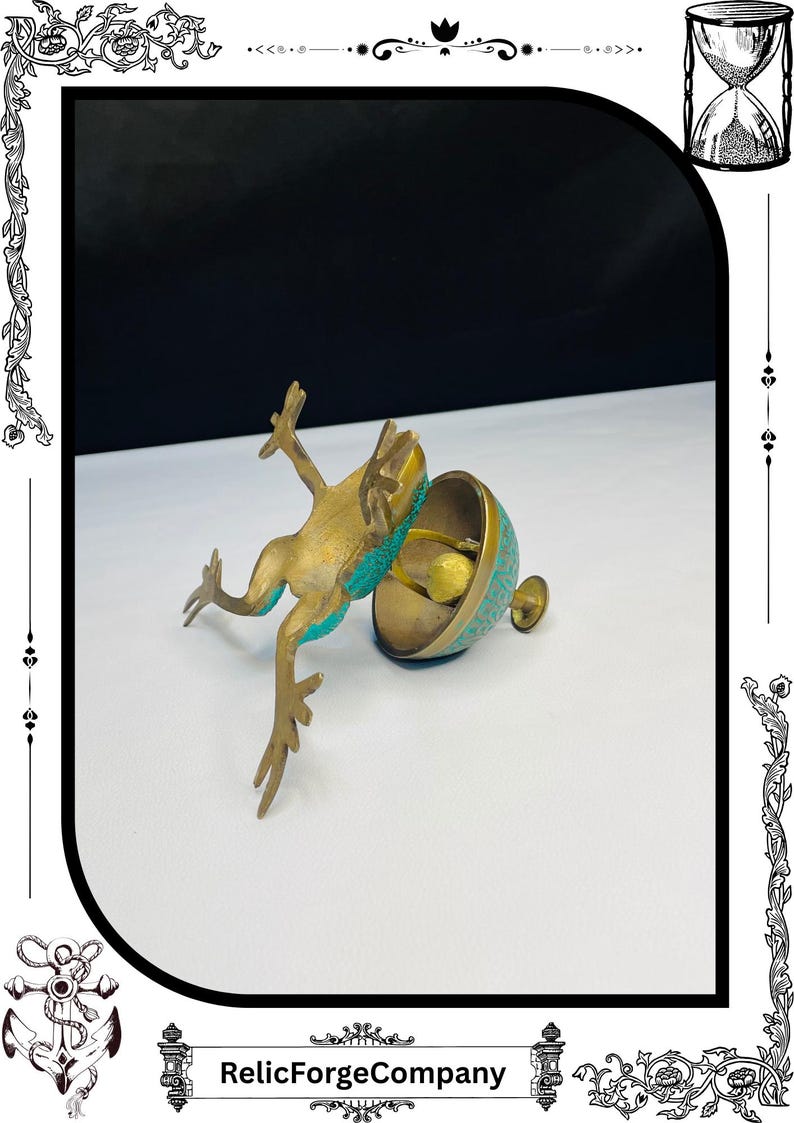 May include: A brass frog figurine with turquoise accents leaps towards a matching bell-shaped container. The container has a detailed pattern and a small handle. The RelicForgeCompany logo is at the bottom.