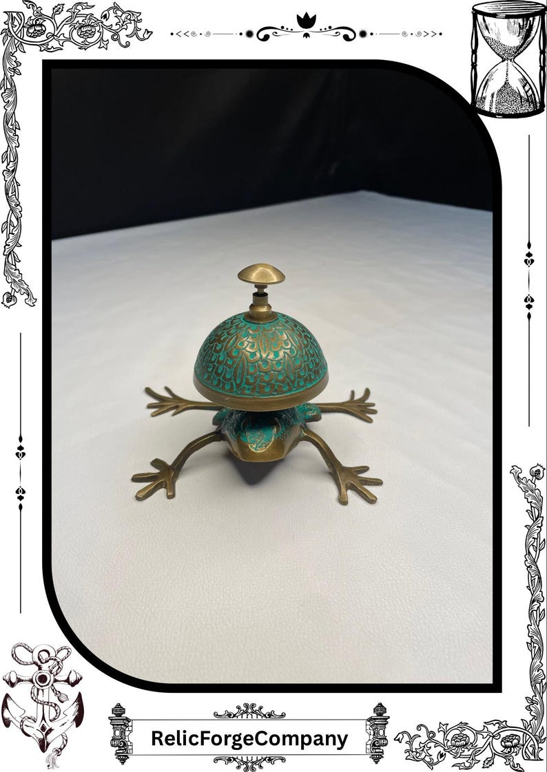 May include: A bronze frog-shaped bell with a turquoise and gold-colored dome. The bell has intricate floral patterns and a small handle on top. The legs are outstretched, giving the bell a whimsical appearance. The text "RelicForgeCompany" is at the bottom.