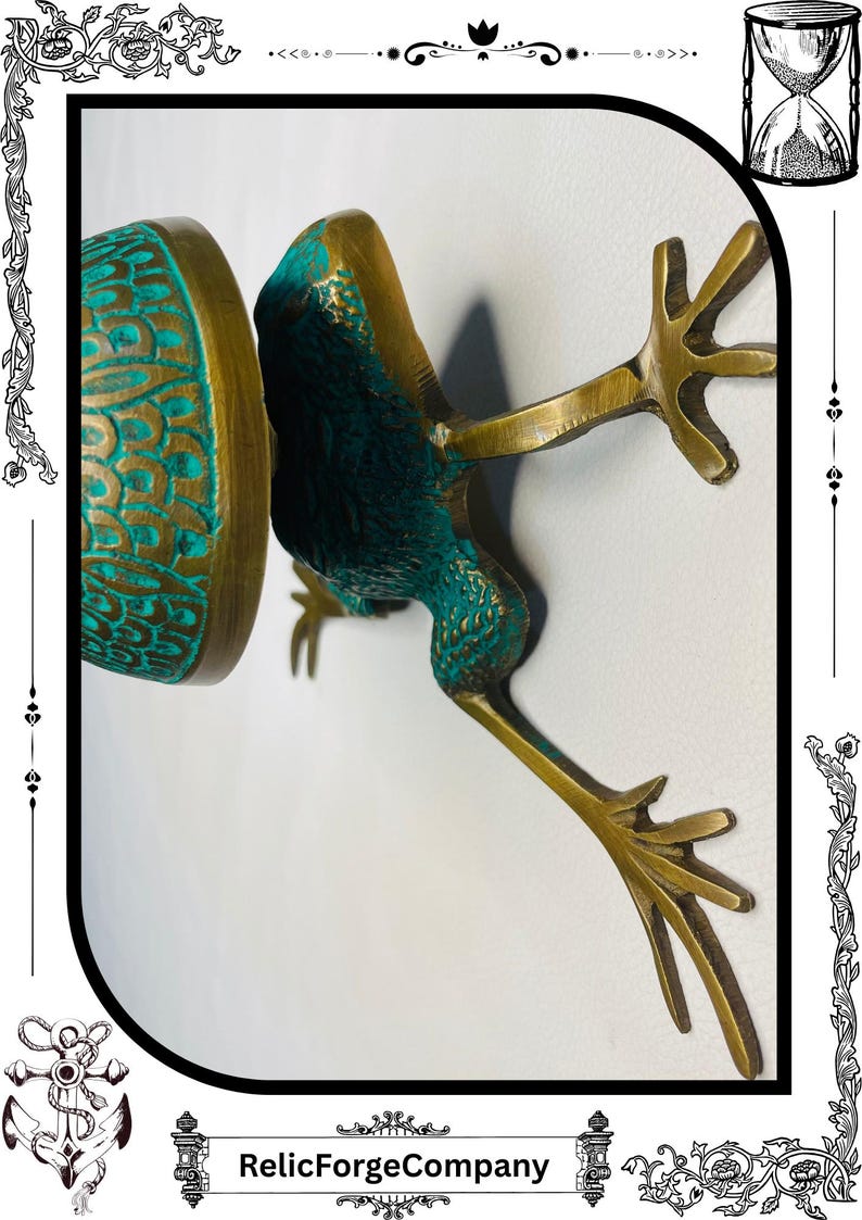 May include: A bronze frog sculpture with verdigris accents. The frog is depicted in a dynamic pose, with outstretched legs and a detailed textured surface. The sculpture has a vintage aesthetic.