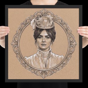 May include: A framed pencil drawing of a woman in a vintage hat and dress, set within an ornate oval frame. The artwork is in sepia tones, with the woman's portrait centered against a tan background. The frame is black.