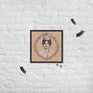 May include: Framed portrait of a woman in a vintage hat and dress, set within an ornate oval frame. The artwork is in sepia tones, with a black frame. Decorative bats and spiders are placed around the frame on a white brick wall.