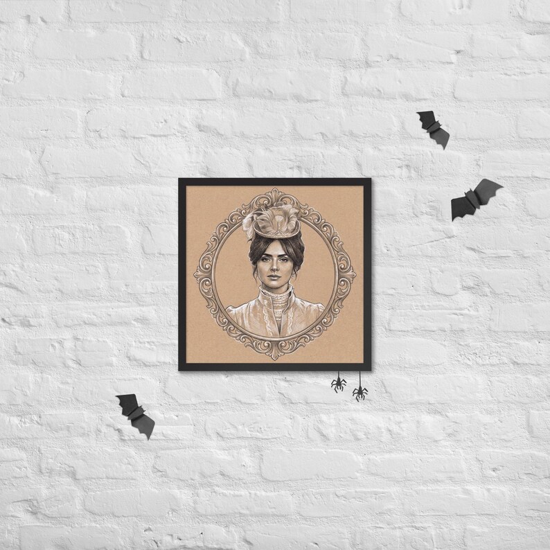 May include: Framed portrait of a woman in a vintage hat and dress, set within an ornate oval frame. The artwork is in sepia tones, with a black frame. Decorative bats and spiders are placed around the frame on a white brick wall.
