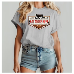 May include: A white ceramic mug with a black handle and the text "But First, Coffee" in a black, handwritten-style font. The mug is on a white surface.