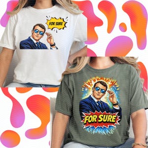 以下が含まれることがあります： 白いTシャツとオリーブグリーンのTシャツの2枚。どちらもサングラスをかけた男性のポップアート風イラストが描かれています。イラストには、吹き出しまたは漫画のスタイルで「FOR SURE」というテキストが含まれています。