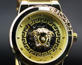 Gerenoveerde automatische Versace met skelet wijzerplaat in gouden wijzerplaat herenhorloge.
