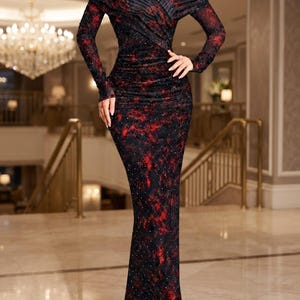 May include: A floor-length, off-the-shoulder long-sleeve dress featuring a dark black and red mottled pattern with scattered small rhinestones. The bodice has a pleated crossover design, and the skirt follows a slim, straight silhouette.