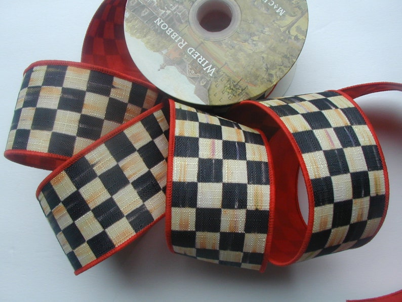 May include: Black and white checkered ribbon with a red edge. The ribbon is wired and has a distressed look.