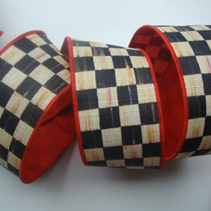 May include: Black and white checkered ribbon with a red edge. The ribbon has a subtle distressed look and is perfect for crafting and decorating.
