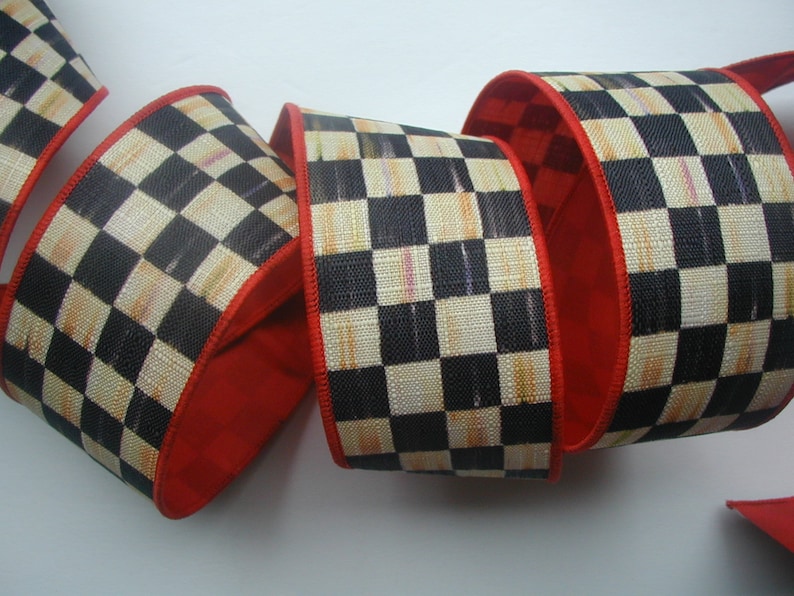 May include: Black and white checkered ribbon with a red edge. The ribbon has a subtle distressed look and is perfect for crafting and decorating.
