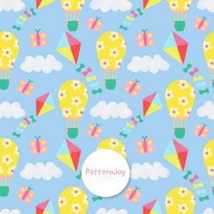 May include: A repeating pattern on a light blue background featuring yellow hot air balloons with white flower accents, pink butterflies, red and blue kites, and white clouds. The PatternJoy studio logo is in the centre.