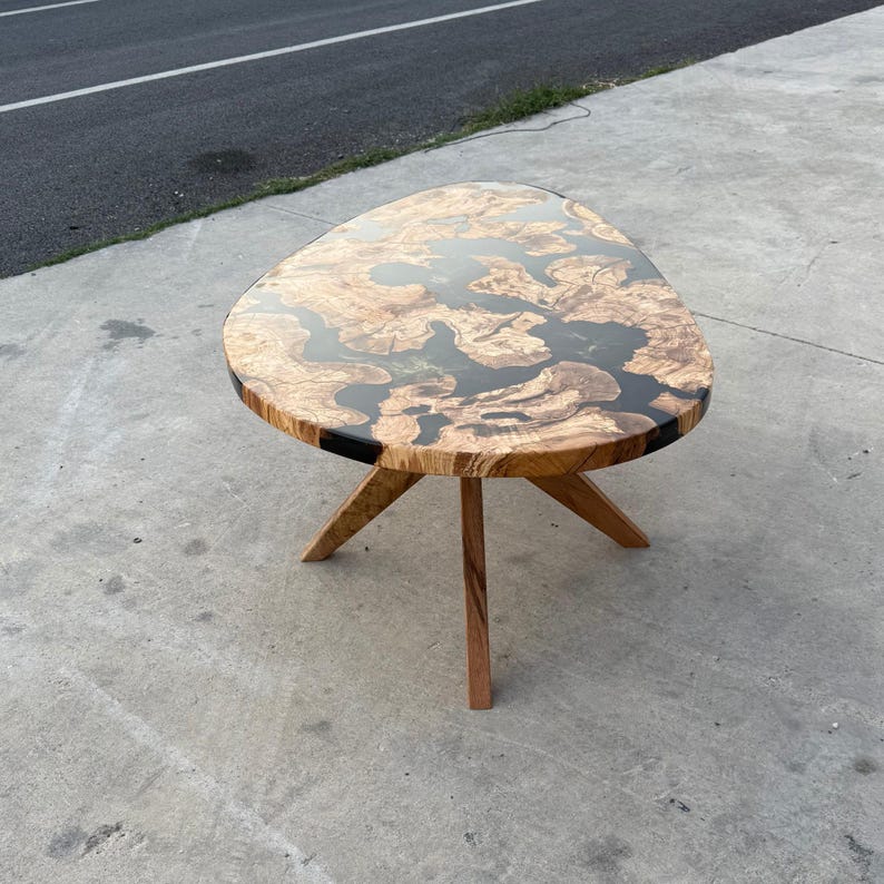 Modern epoxy resin coffee table in living room — minimalist handmade decor
