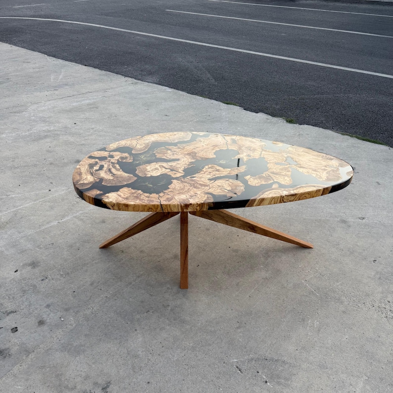 Glossy epoxy resin showing natural olive wood texture and grain