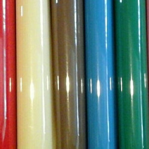 May include: A collection of 18 different colored round rods. The rods are arranged in a row from left to right. The colors are: gold, silver, orange, navy blue, red, cream, brown, light blue, dark green, pink, purple, maroon, black, white, light green, dark blue, yellow, and light purple.