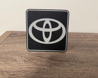 Cubierta de enganche con clic automático y logotipo de Toyota más grande