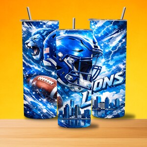 May include: Three stainless steel tumblers with lids and straws. Each tumbler features a blue and white design with a football helmet, a roaring lion, and a football. The word "LIONS" is visible on one of the tumblers.