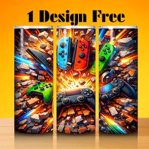 May include: Three stainless steel tumblers with a gaming theme. Each tumbler features a different controller design in vibrant colors, set against a background of exploding rock fragments. The text "1 Design Free" is at the top.
