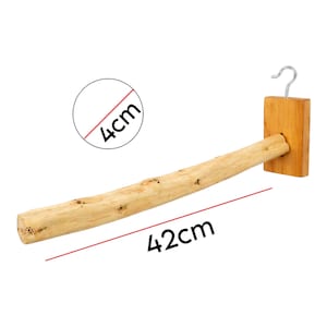 May include: A natural wood bird perch with a metal hook, measuring 42cm long and 4cm wide. The perch is made from a light-coloured, textured branch, attached to a wooden block with a hook for hanging. Suitable for pet birds.