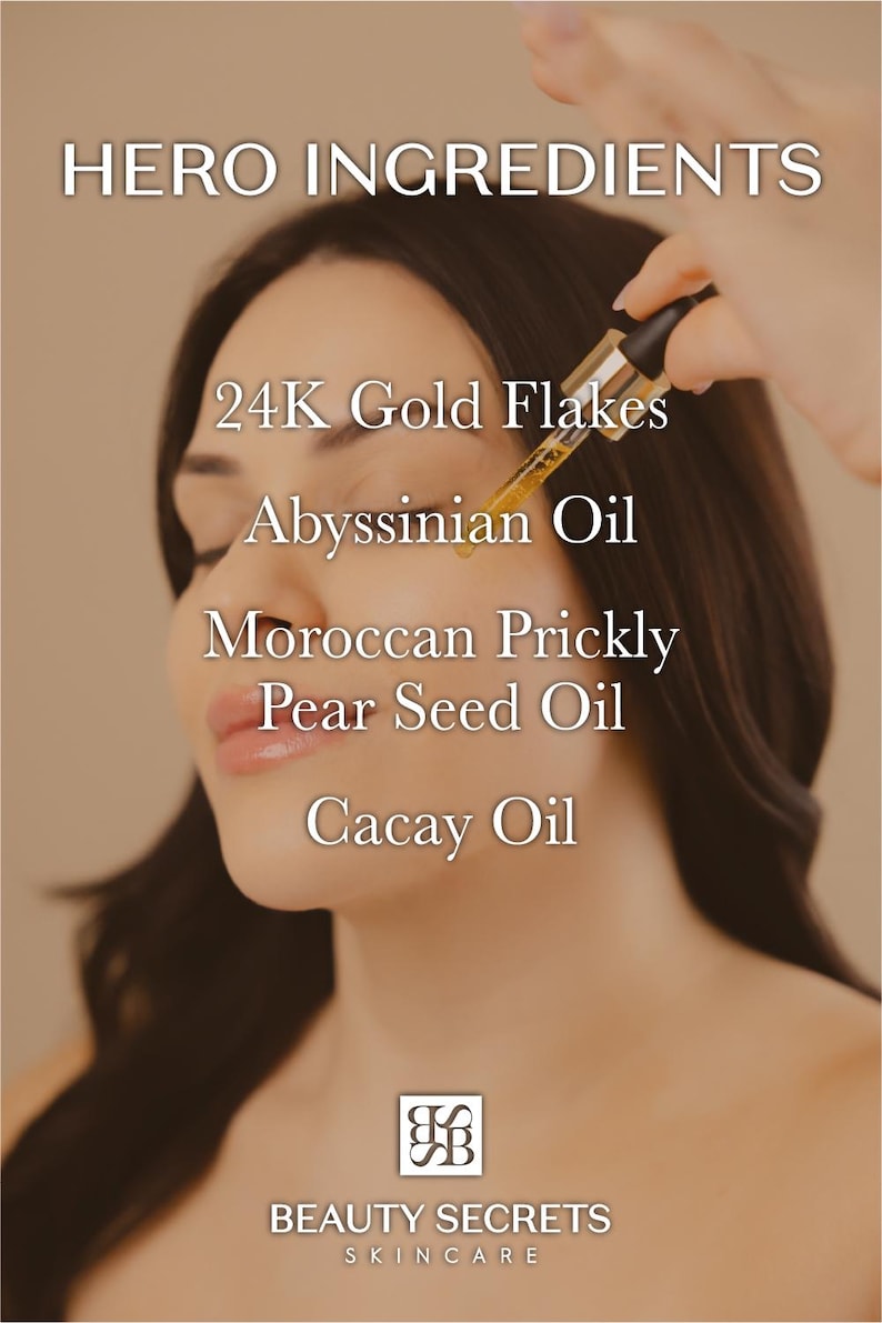 Puede incluir: Un gotero de vidrio que dispensa un l&iacute;quido dorado con hojuelas de oro de 24 quilates sobre la piel. El texto dice: HERO INGREDIENTS, 24K Gold Flakes, Abyssinian Oil, Moroccan Prickly Pear Seed Oil, Cacay Oil y el logo BEAUTY SECRETS SKINCARE.