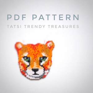 May include: PDF pattern for a beaded cheetah head. The cheetah is orange and brown with green eyes. The pattern is from Tatsi Trendy Treasures.