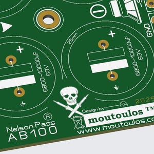 May include: Green circuit board with white and gold details. Features include capacitor symbols, text that reads "Nelson Pass AB100", and a skull and crossbones logo. The board also has the text "Design by moutoulos" and "www.moutoulos.com".