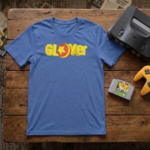 Camiseta retro con insignia de Glover / Camiseta con la mascota de N64 de 64 bits / Gráfico clásico de juego de plataformas con bola rodante