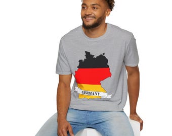 May include: A gray t-shirt featuring a graphic of the German flag in a map outline. The flag design includes black, red, and yellow stripes, with the word "GERMANY" on a banner below the map.