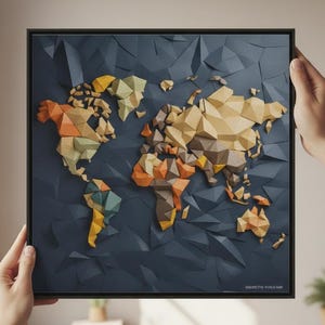 May include: A framed, geometric world map with a dark blue background and colorful continents. The map is held by two hands, showcasing the 3D effect of the design. The continents are rendered in shades of orange, yellow, and green.
