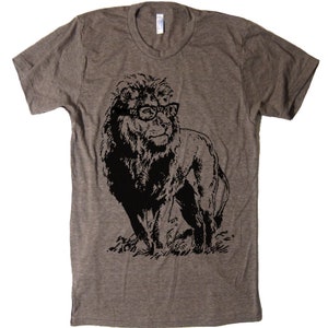 May include: A heather grey t-shirt with a black and white graphic of a lion wearing glasses.