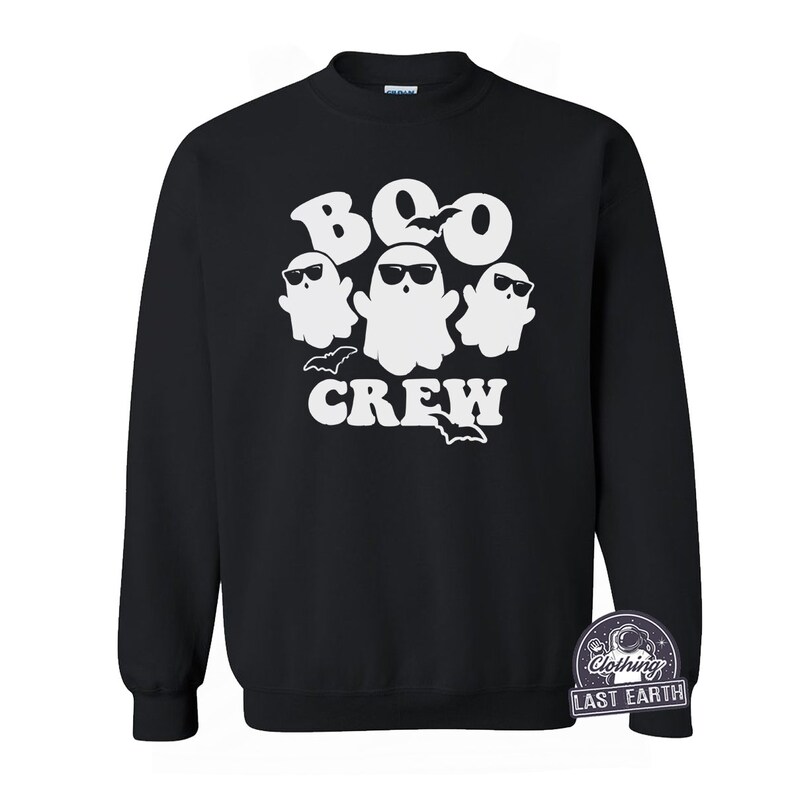 May include: Black sweatshirt with a white graphic of three ghosts wearing sunglasses and the text "BOO CREW".