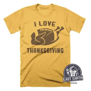 May include: A yellow t-shirt with the text "I Love Thanksgiving" and a brown cartoon turkey shaped like a football.