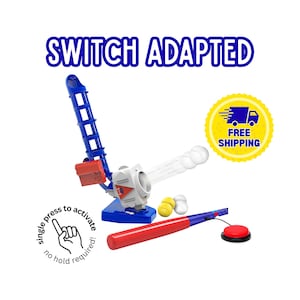May include: A blue and red baseball pitching machine with a red and blue bat. The machine has a white ball launcher and includes a red button and the text "SWITCH ADAPTED".