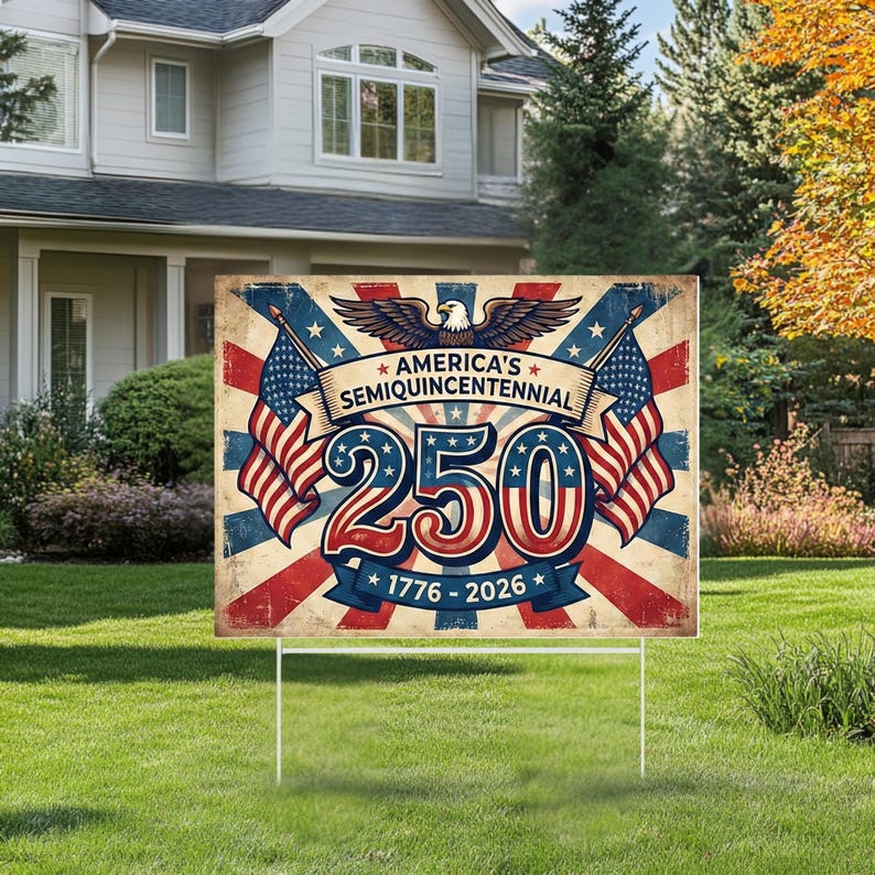 May include: A rectangular garden sign with a vintage design celebrating America's Semiquincentennial. The sign features the number 250, American flags, and the years 1776-2026. The sign is supported by a white metal stake and is displayed on a green lawn.