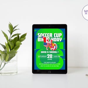 May include: A digital tablet displays a soccer-themed birthday invitation. The invitation features the text "Soccer Cup Birthday" in green and blue, with flags and a soccer ball graphic. The date is June 20th, and the time is 3:00 PM.