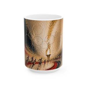 May include: White ceramic mug with an artistic design depicting a track and field event. The artwork includes runners, a torch, and Olympic rings in gold, red, and blue. The mug has a glossy finish and a standard handle.