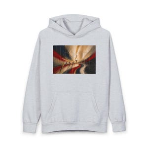 May include: Pale grey hoodie with a front pocket and a hood. The front of the hoodie displays a vibrant abstract artwork. The design incorporates red, white, and blue colours, possibly representing a path or road with figures and a central light source.