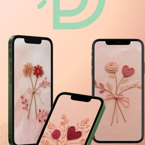 May include: Three smartphones with green frames display embroidered floral designs on their screens. The designs include flowers, hearts, and bows in shades of pink and red. The background is a soft peach color.
