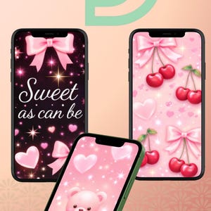 Könnte beinhalten: Drei Smartphones mit pinkfarbenen Hintergrundbildern. Eines zeigt einen Teddybären, ein anderes Kirschen und das dritte eine Schleife und den Text "Sweet as can be". Die Telefone haben schwarze Bildschirme und grüne oder schwarze Rahmen.