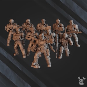 May include: A group of miniature soldiers in various poses, each armed with weapons and wearing tactical gear. The figures are in a neutral color, with detailed sculpting of uniforms and equipment. The overall theme suggests a military or war game.