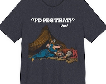 May include: Dark heather gray t-shirt featuring a graphic illustration of a biblical scene with the text "I'D PEG THAT!" -Jael. The illustration depicts a woman in blue striking a man with a hammer.