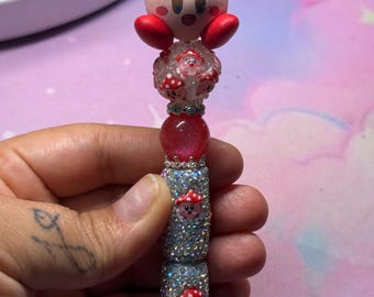 Multiple characters beaded pen