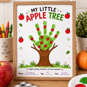 May include: A framed art print titled MY LITTLE APPLE TREE featuring a handprint tree with red fingerprint apples. The design includes green grass, small flowers, and the text Apple picking memories are the sweetest! with blank lines for Name, Age, and Year.