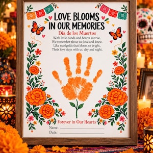 May include: A framed print titled Love Blooms In Our Memories for Día de los Muertos. It features orange marigold illustrations, two butterflies, and a central orange handprint. Text includes a poem, Name, and Date lines.