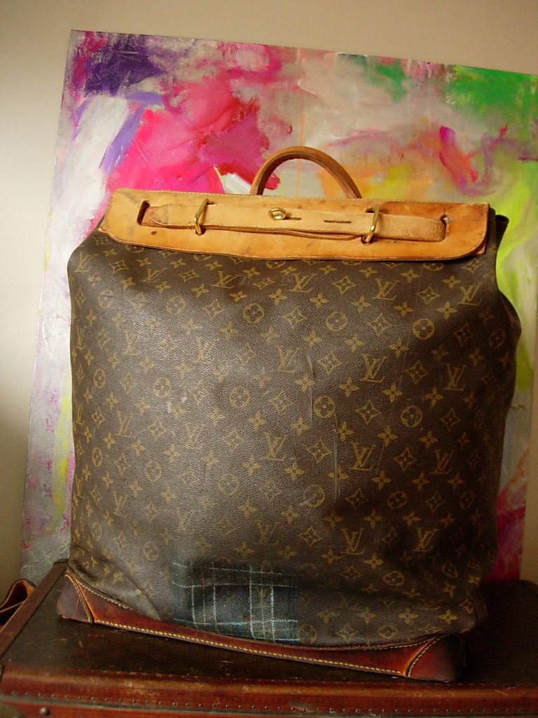 Lot - Louis Vuitton Extra Large Monogram Steamer Travel bag. France 1980's.  Scuffs to leather base and monogrammed bag, small split to bag. No pad  lock. Bag Height 22.75, bottom size 25.375 x 10.75 in