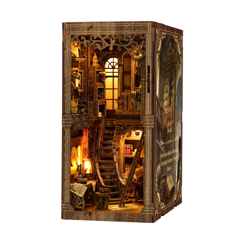 May include: A wooden bookshelf model with intricate details, featuring a staircase, ladder, and multiple shelves filled with miniature books and decor. The model has warm lighting, creating a cozy atmosphere. The exterior is decorated with ornate carvings.