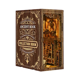 May include: A wooden Ancient Book Collection Room model with intricate details. The front cover reads "Ancient Book" and "Collection Room" with decorative gold accents. The interior features a detailed room with a ladder and illuminated elements.